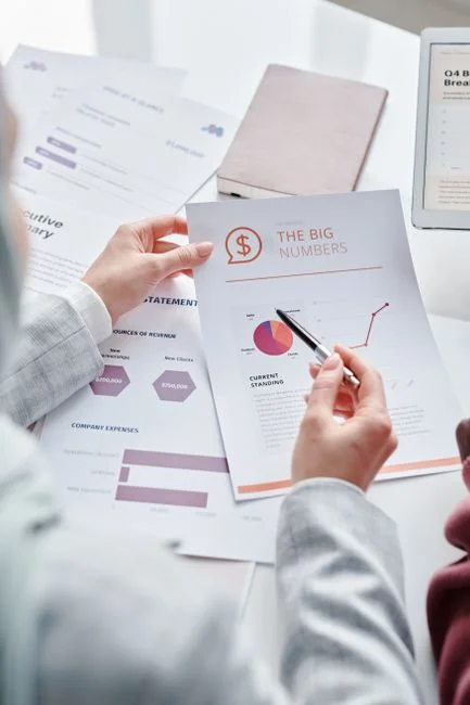 Close-up of various marketing documents on a desk, perfect for business and strategy discussions.